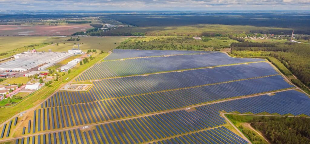 Solar power plant in the field. Aerial view of Solar panels.